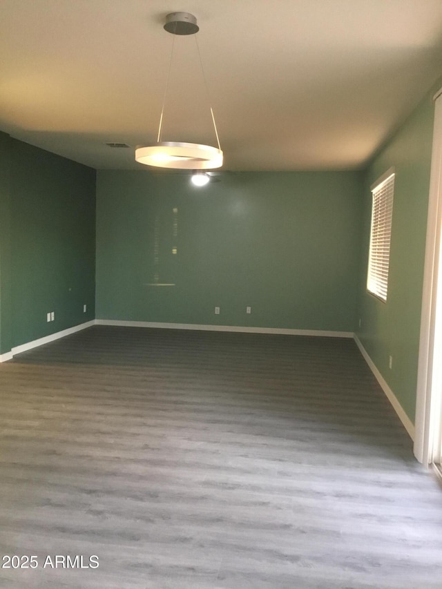 4722 S 238th Ln, Buckeye, AZ 85326 - unfurnished room with wood finished floors and baseboards