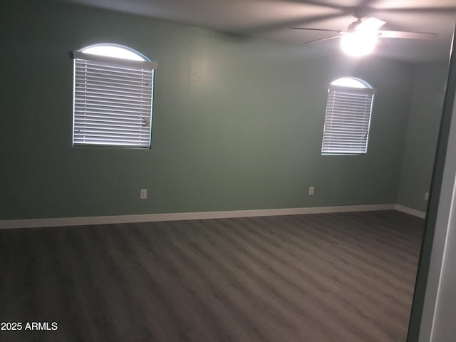 4722 S 238th Ln, Buckeye, AZ 85326 - spare room with a ceiling fan, dark wood-style floors, and baseboards