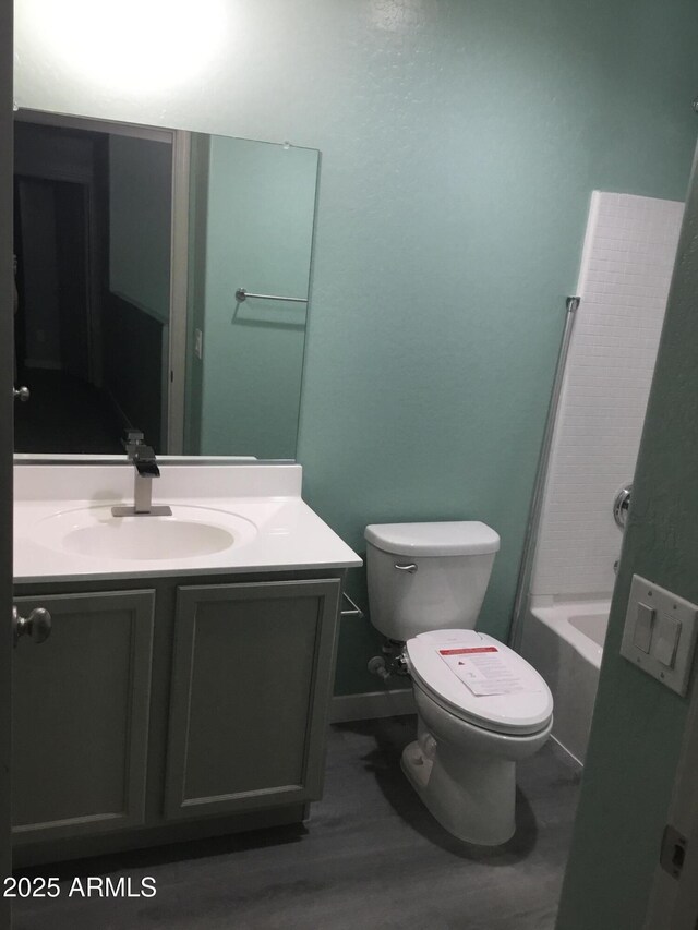 4722 S 238th Ln, Buckeye, AZ 85326 - bathroom featuring vanity, toilet, wood finished floors, and a bathtub