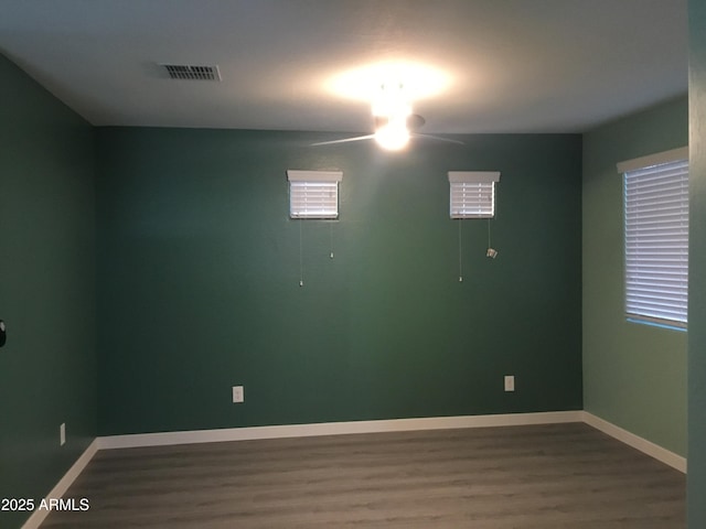 4722 S 238th Ln, Buckeye, AZ 85326 - unfurnished room featuring wood finished floors, baseboards, and ceiling fan