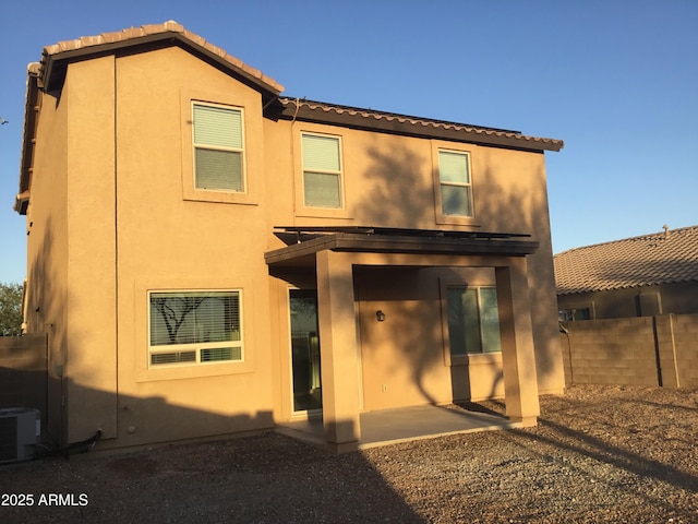 4722 S 238th Ln, Buckeye, AZ 85326 - rear view of property featuring a tiled roof, stucco siding, a patio area, and cooling unit