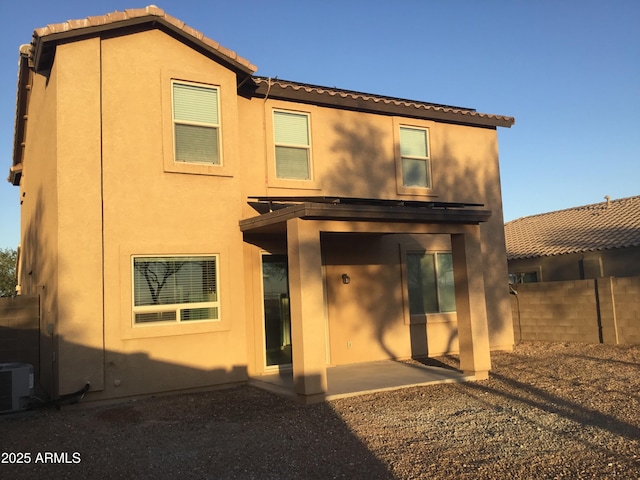 4722 S 238th Ln, Buckeye, AZ 85326 - back of house with stucco siding, a tiled roof, a patio, and central AC