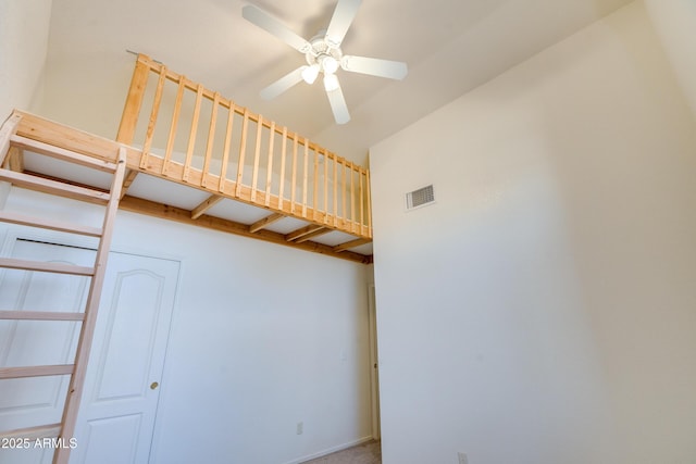 stairway with ceiling fan