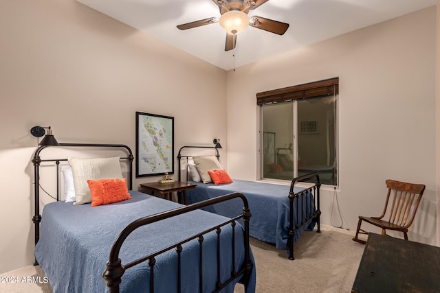 bedroom featuring light carpet and ceiling fan