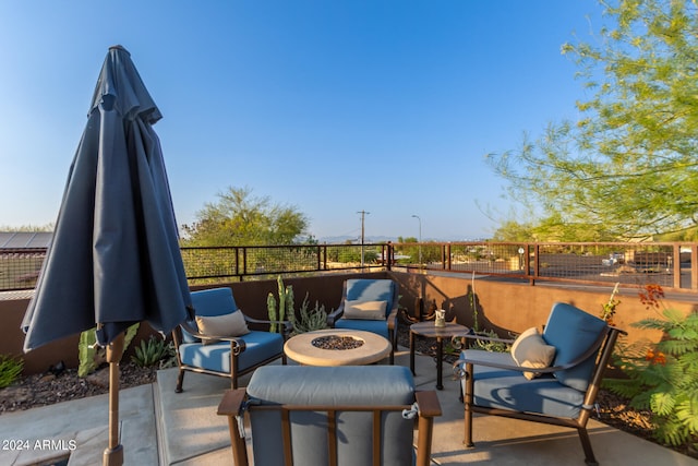 view of patio / terrace featuring an outdoor fire pit