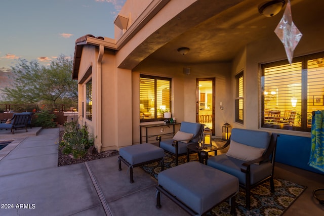 view of patio terrace at dusk