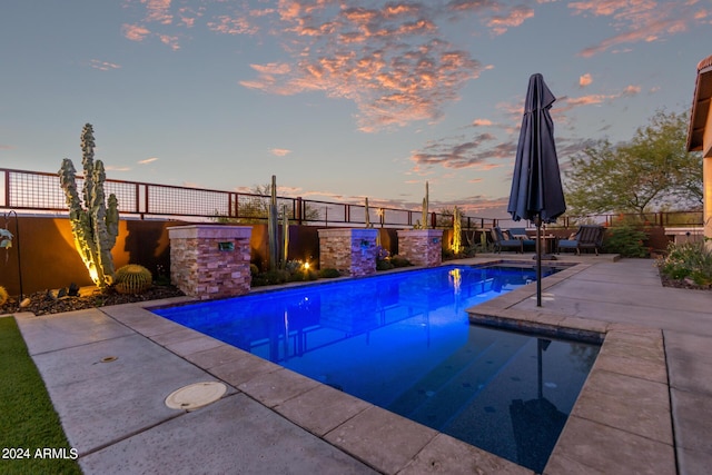 view of pool featuring fence, a fenced in pool, and a patio