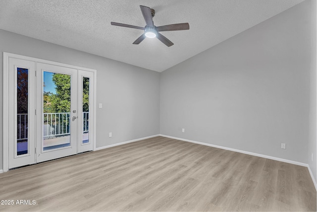 spare room with baseboards, a textured ceiling, ceiling fan, and light wood-style flooring
