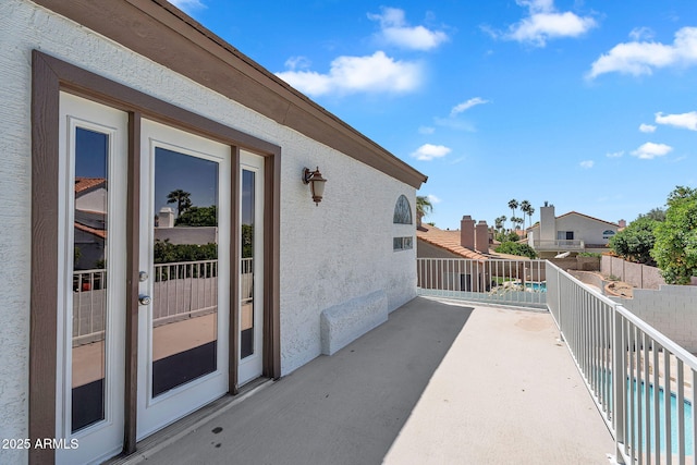 view of patio with fence and a fenced in pool