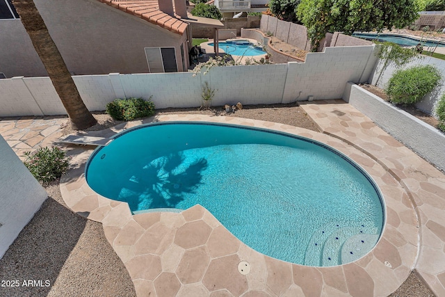 view of swimming pool featuring a fenced in pool and a fenced backyard