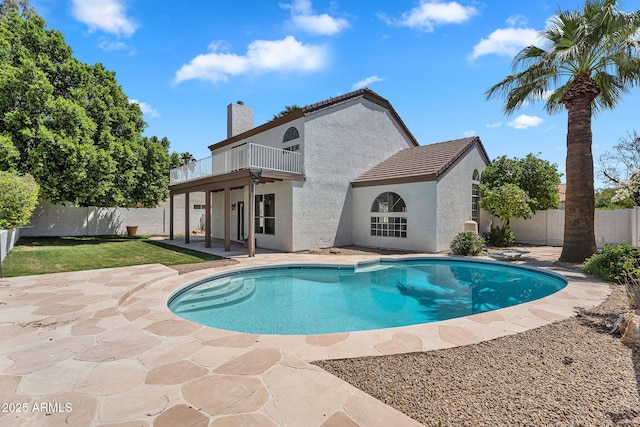 view of pool with a fenced in pool, a fenced backyard, and a patio area