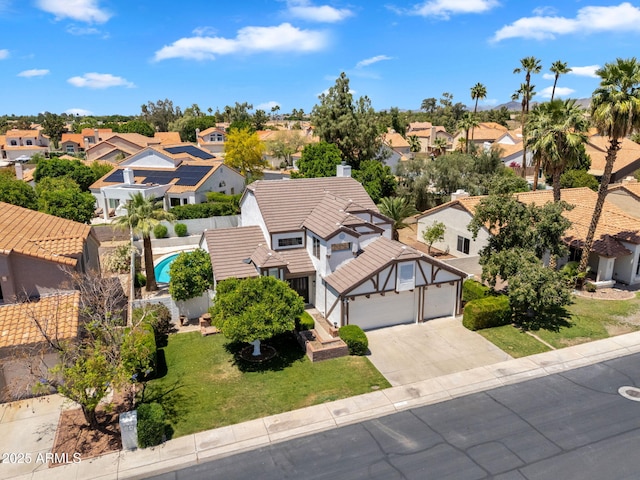birds eye view of property with a residential view