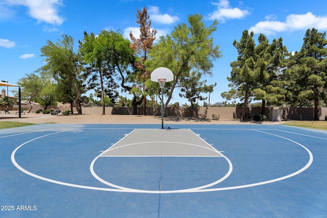 view of basketball court featuring fence and community basketball court