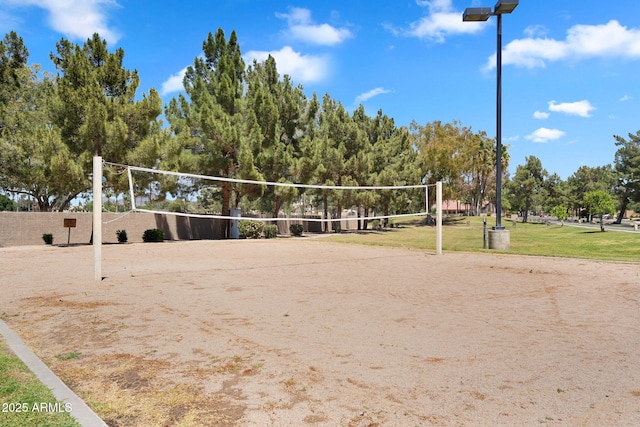 view of property's community with a yard and volleyball court