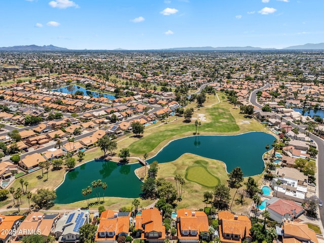 bird's eye view featuring a residential view, view of golf course, and a water and mountain view