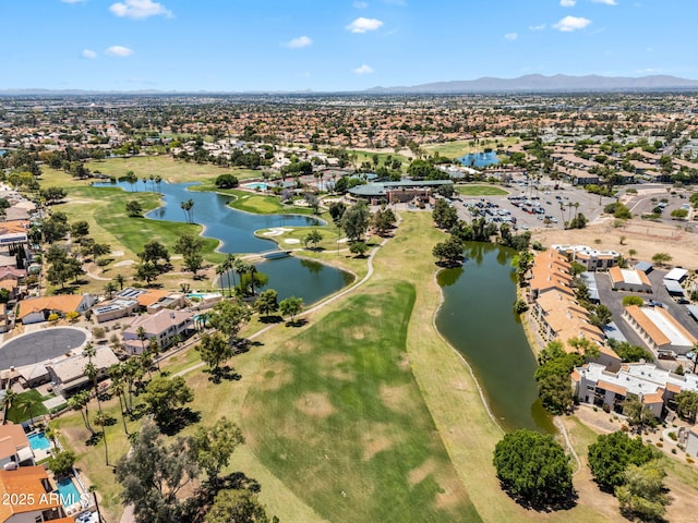 aerial view with a residential view, a water and mountain view, and golf course view