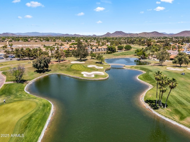 bird's eye view featuring a water and mountain view, view of golf course, and a residential view