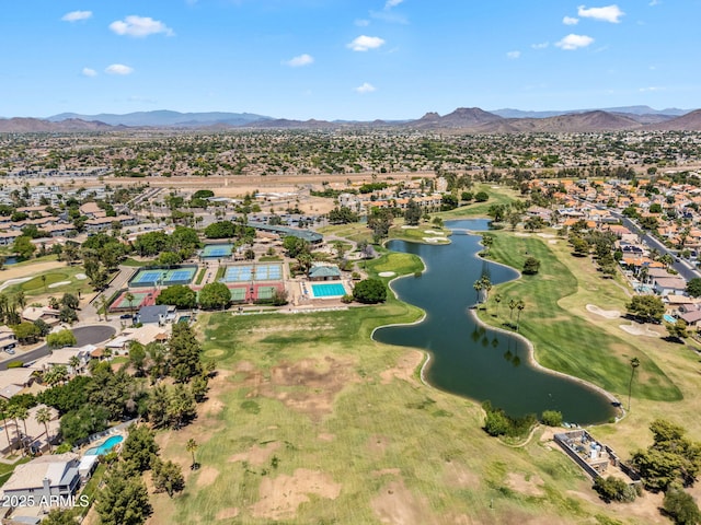 birds eye view of property featuring view of golf course, a residential view, and a water and mountain view