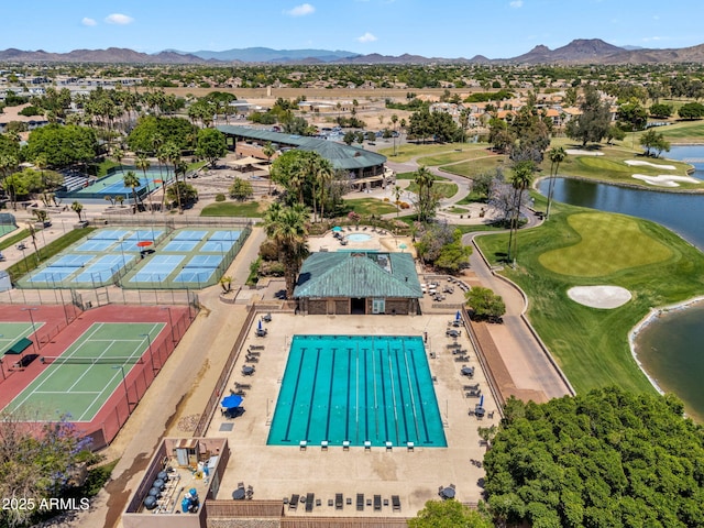 birds eye view of property featuring a residential view, view of golf course, and a water and mountain view