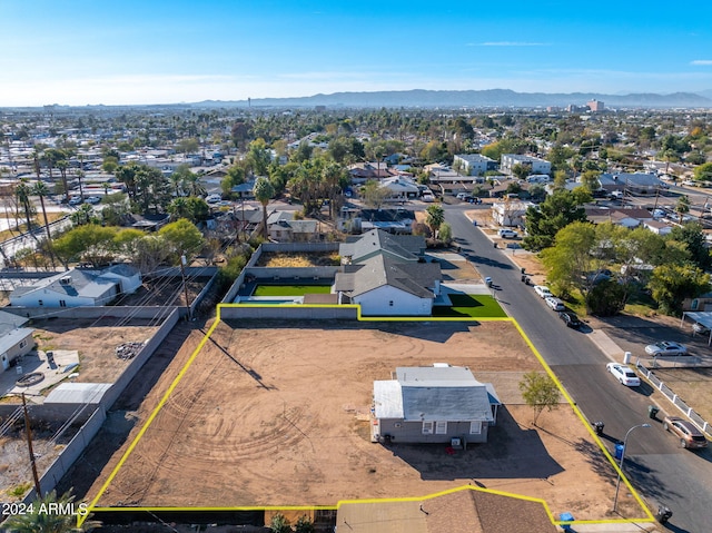 birds eye view of property with a mountain view