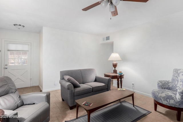 living room featuring light tile patterned flooring and ceiling fan