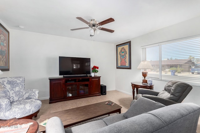 tiled living room featuring ceiling fan