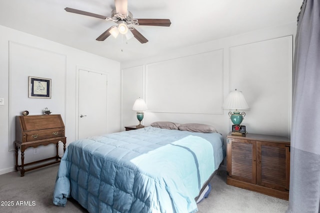 bedroom with ceiling fan and light colored carpet