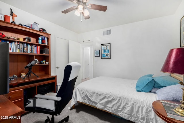 bedroom with ceiling fan and carpet flooring