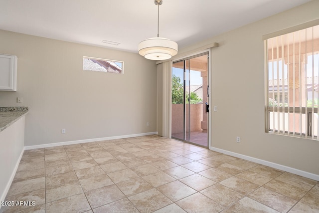 20007 N Siesta Rock Dr, Surprise, AZ 85374 - unfurnished dining area with baseboards and light tile patterned floors