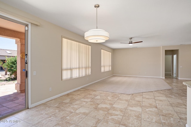 20007 N Siesta Rock Dr, Surprise, AZ 85374 - empty room featuring a ceiling fan and baseboards