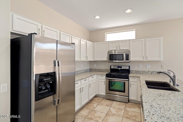 20007 N Siesta Rock Dr, Surprise, AZ 85374 - kitchen featuring stainless steel appliances, a sink, white cabinets, and recessed lighting