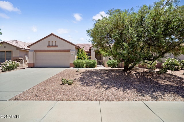 20007 N Siesta Rock Dr, Surprise, AZ 85374 - view of front of house with stucco siding, an attached garage, a tiled roof, concrete driveway, and fence