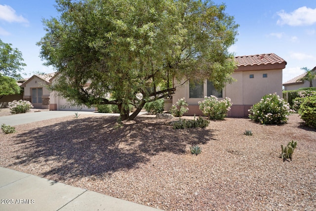 20007 N Siesta Rock Dr, Surprise, AZ 85374 - view of front of home with a tiled roof, stucco siding, and driveway