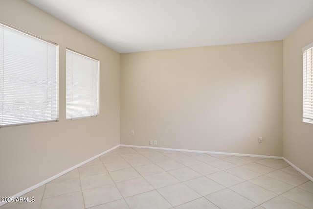 20007 N Siesta Rock Dr, Surprise, AZ 85374 - spare room with baseboards and light tile patterned floors