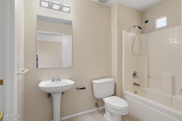 20007 N Siesta Rock Dr, Surprise, AZ 85374 - bathroom with toilet, tile patterned flooring, shower / bathtub combination, a sink, and baseboards