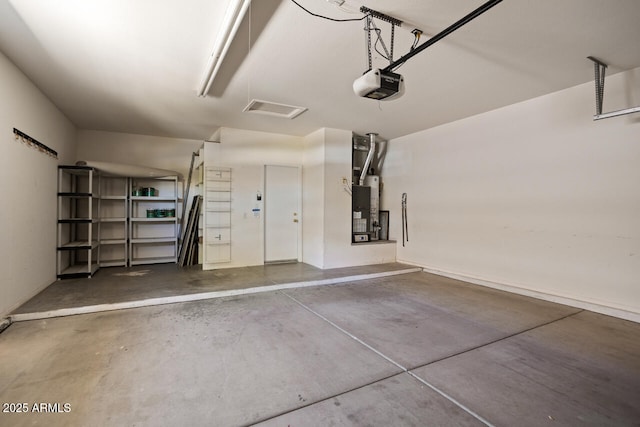 20007 N Siesta Rock Dr, Surprise, AZ 85374 - garage featuring a garage door opener and baseboards