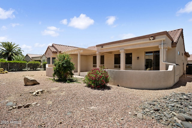 20007 N Siesta Rock Dr, Surprise, AZ 85374 - rear view of house featuring fence, stucco siding, a tiled roof, and central air condition unit