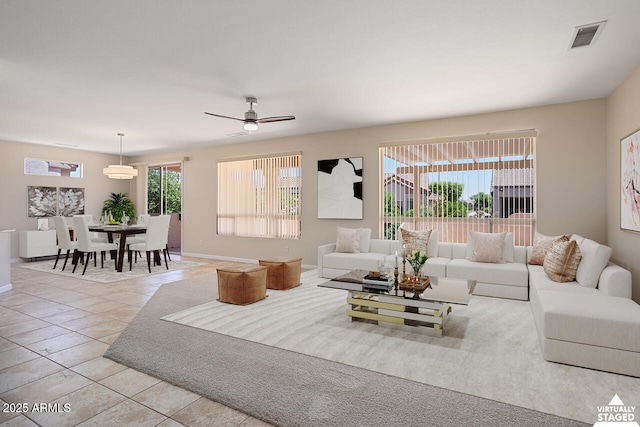 20007 N Siesta Rock Dr, Surprise, AZ 85374 - living area featuring light tile patterned floors, baseboards, and ceiling fan