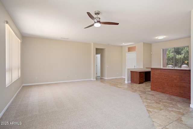 20007 N Siesta Rock Dr, Surprise, AZ 85374 - unfurnished living room with a ceiling fan, baseboards, and light tile patterned floors