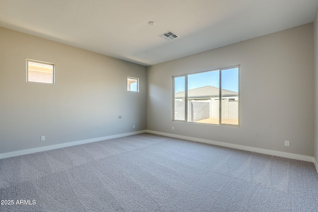 spare room with light colored carpet