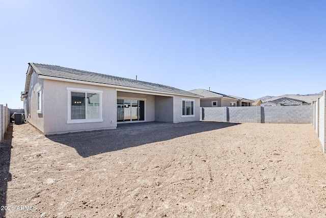 rear view of house with central AC