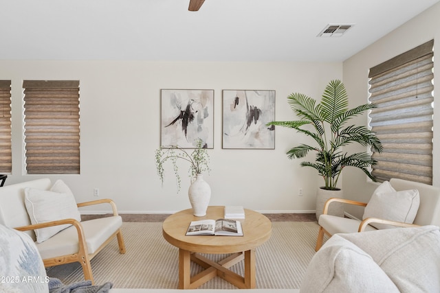 973 E Kelsi Ave, San Tan Valley, AZ 85140 - living area featuring baseboards, carpet, and a ceiling fan