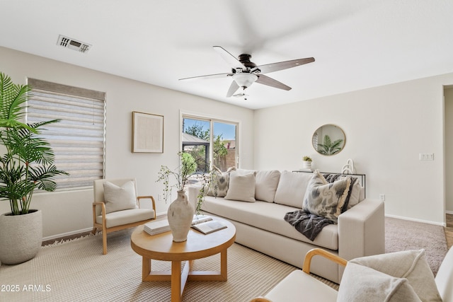 973 E Kelsi Ave, San Tan Valley, AZ 85140 - carpeted living area with baseboards and ceiling fan