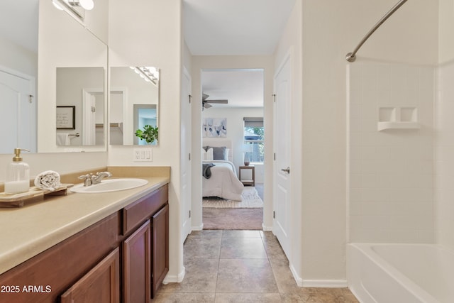 973 E Kelsi Ave, San Tan Valley, AZ 85140 - ensuite bathroom with vanity, bathing tub / shower combination, tile patterned flooring, and baseboards