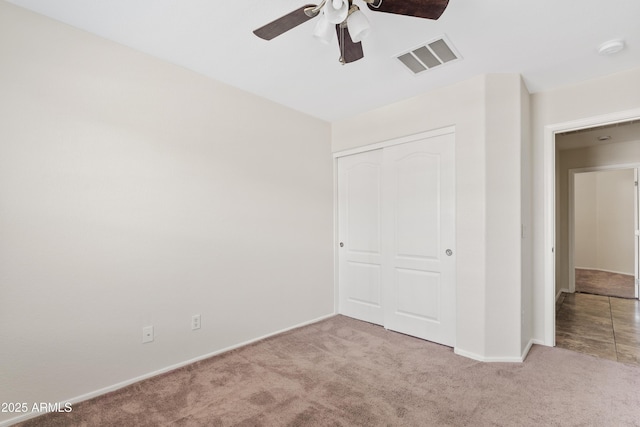 973 E Kelsi Ave, San Tan Valley, AZ 85140 - unfurnished bedroom with carpet flooring, a closet, baseboards, and ceiling fan