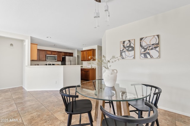 973 E Kelsi Ave, San Tan Valley, AZ 85140 - dining space with light tile patterned floors and baseboards