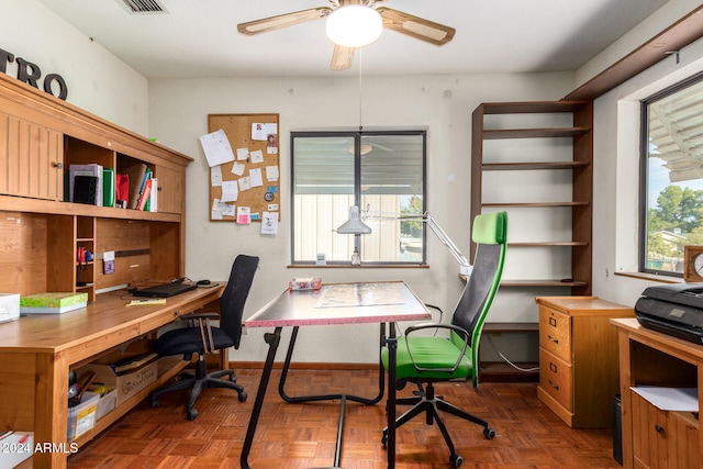 home office featuring ceiling fan and dark parquet flooring