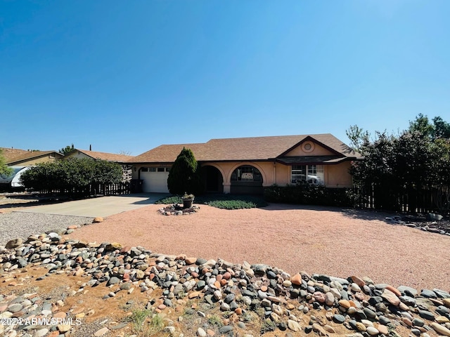 single story home featuring a garage