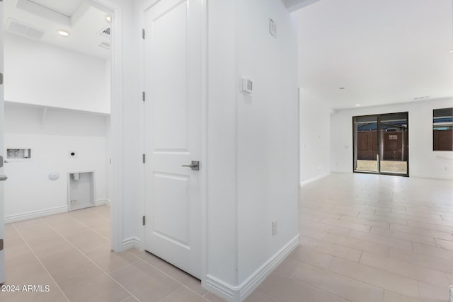 corridor with light tile patterned flooring