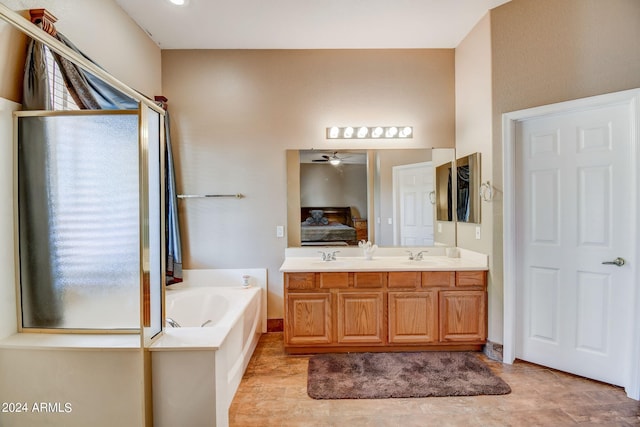 bathroom with vanity, ceiling fan, and a bathing tub